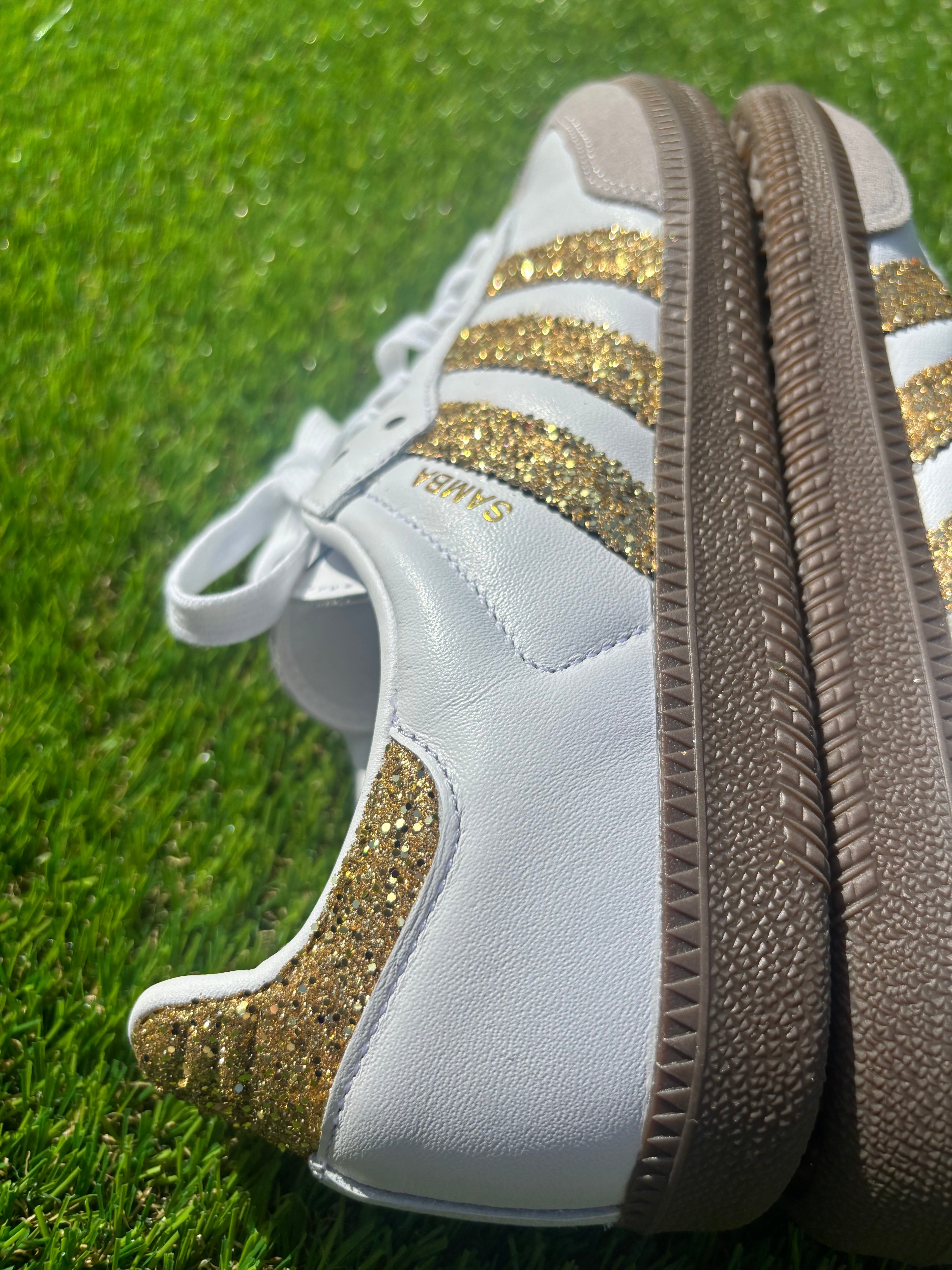 Gold glitter Adidas samba OG sneakers.