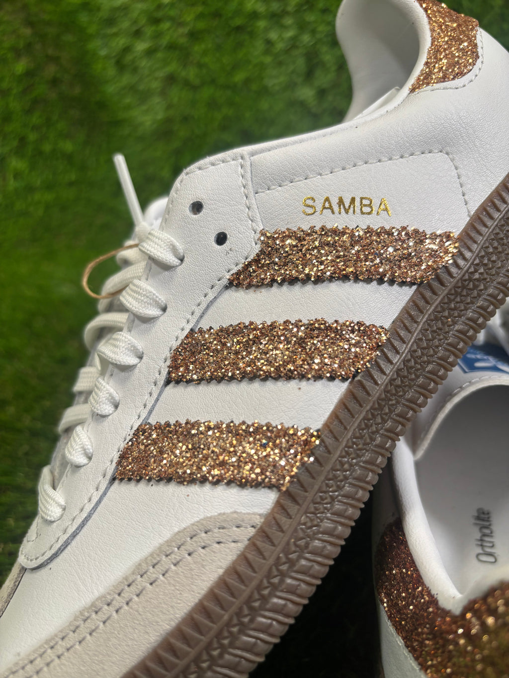 Rose gold glitter Adidas samba OG sneakers.