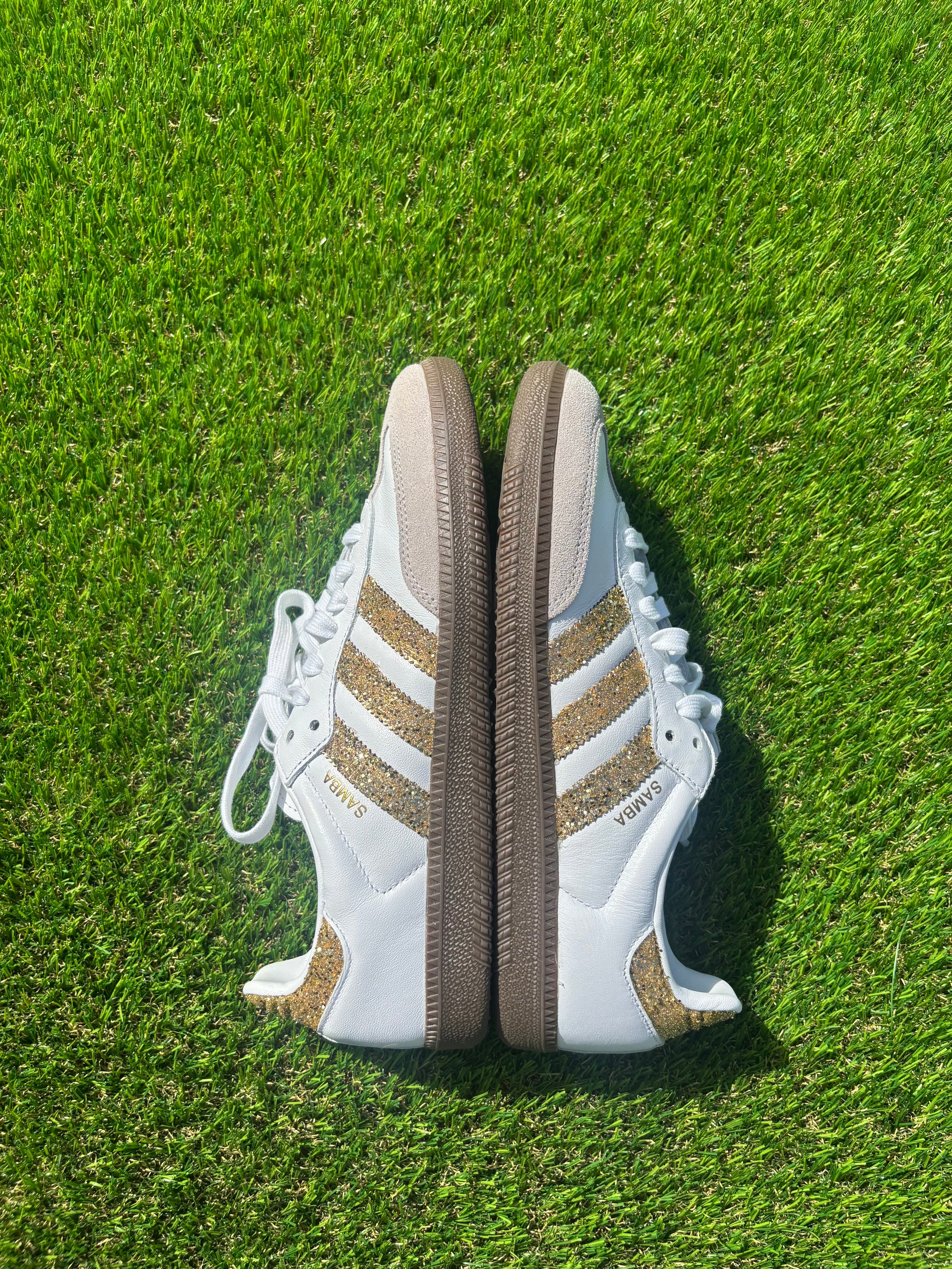 Gold glitter Adidas samba OG sneakers.