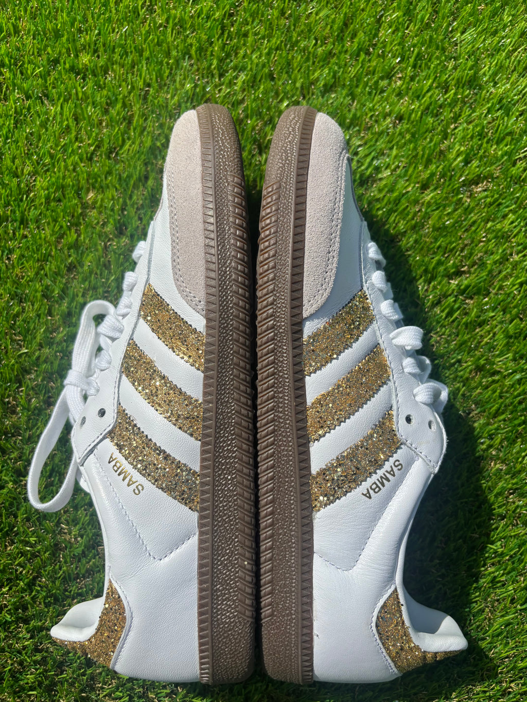 Gold glitter Adidas samba OG sneakers.
