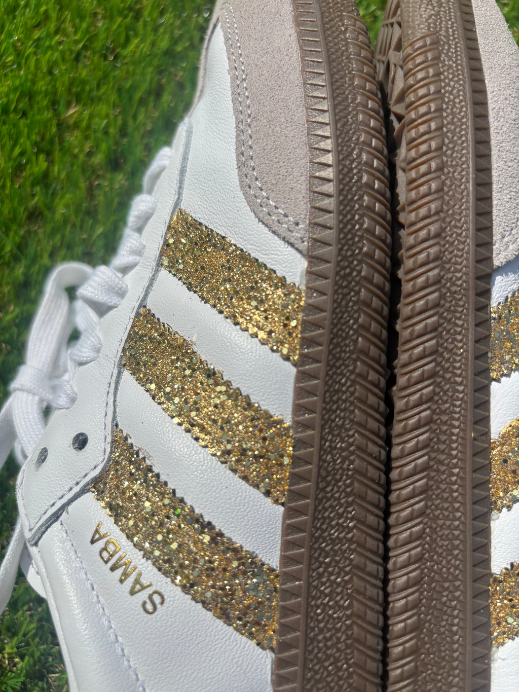 Gold glitter Adidas samba OG sneakers.