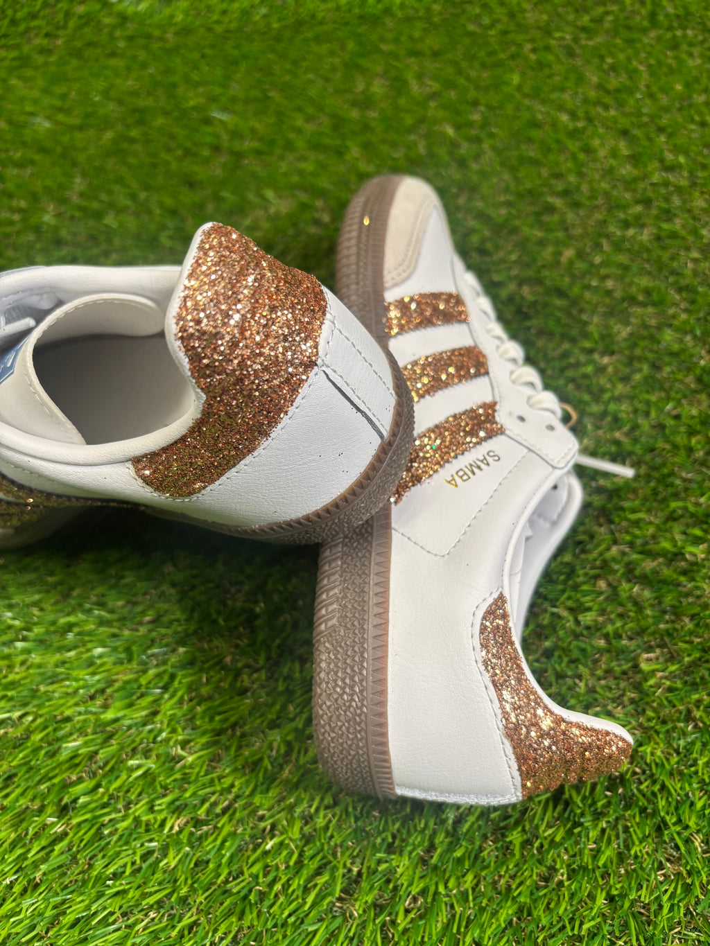 Rose gold glitter Adidas samba OG sneakers.