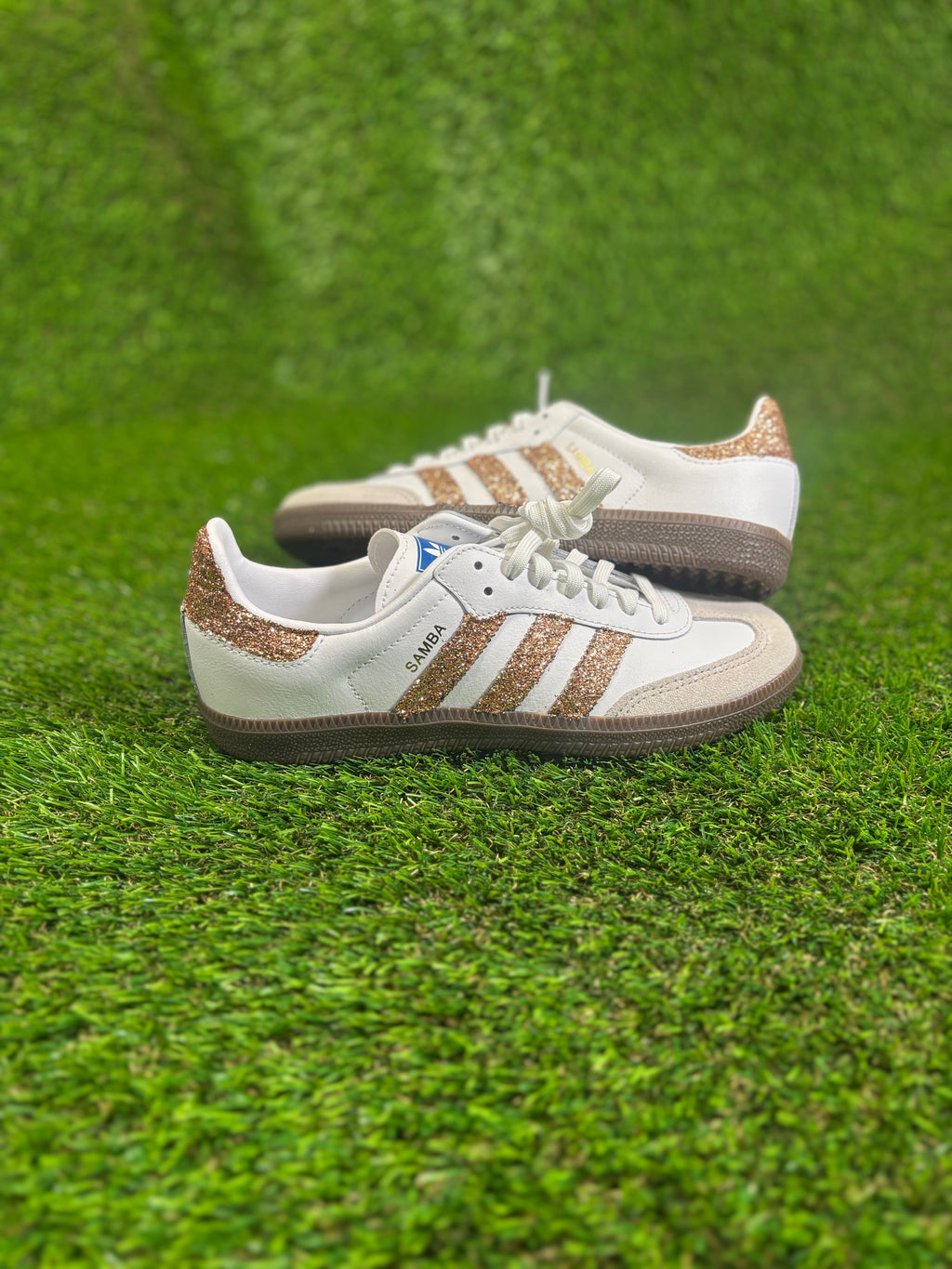 Rose gold glitter Adidas samba OG sneakers.