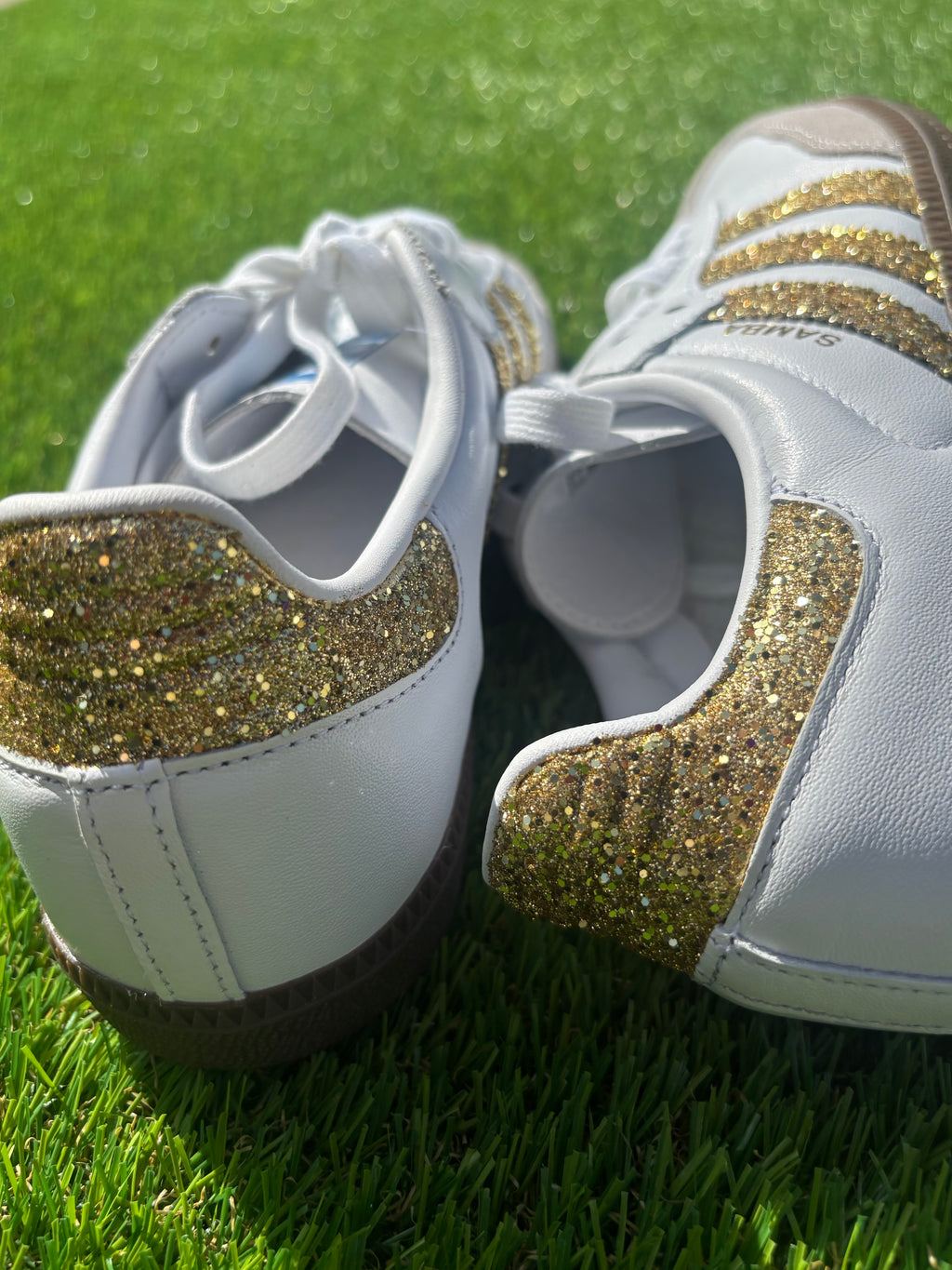 Gold glitter Adidas samba OG sneakers.