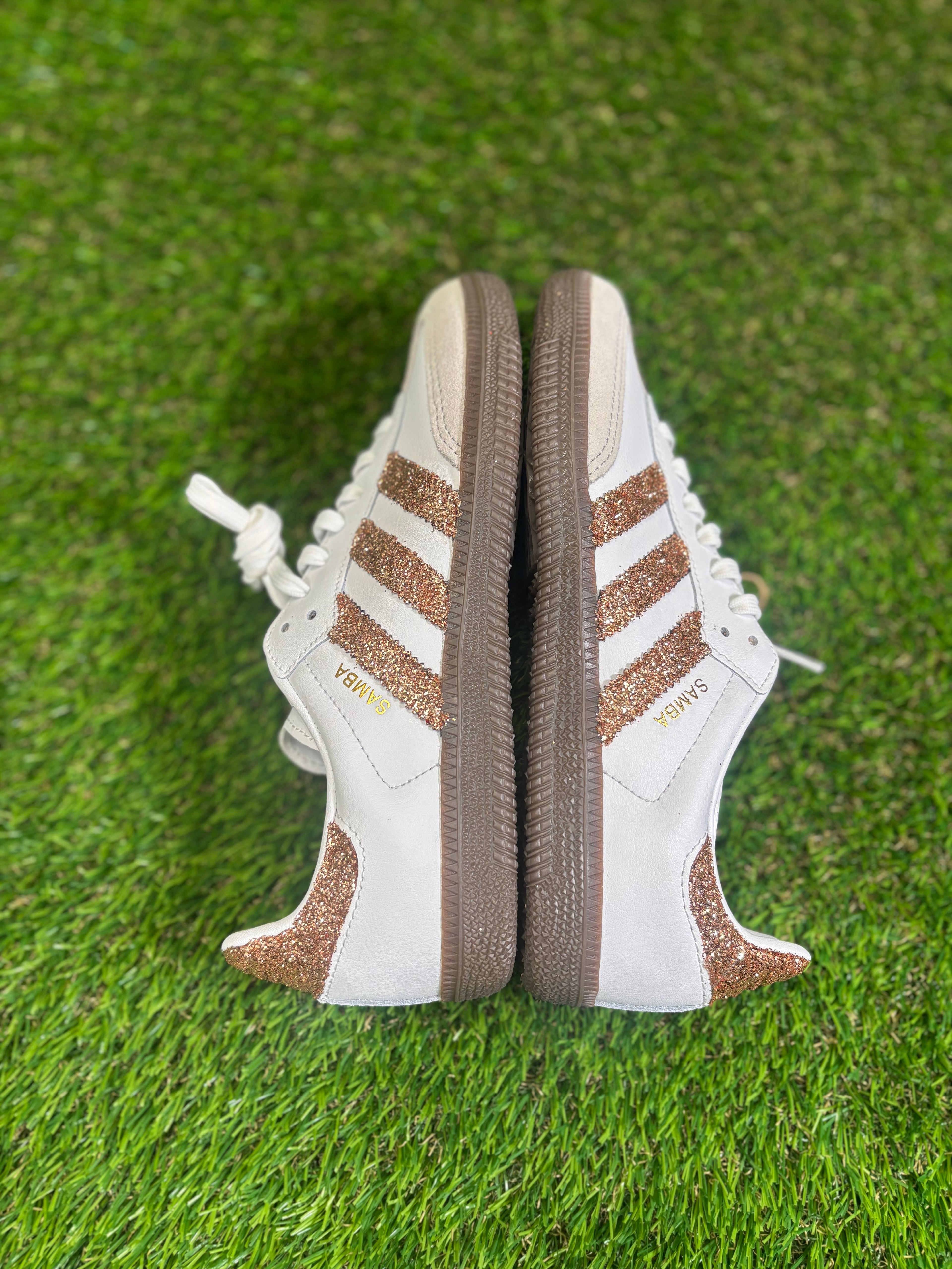 Rose gold glitter Adidas samba OG sneakers.